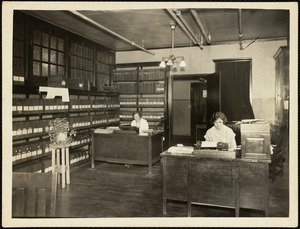 Women, possibly secretaries or office clerks, doing clerical work on Long Island in Boston Harbor