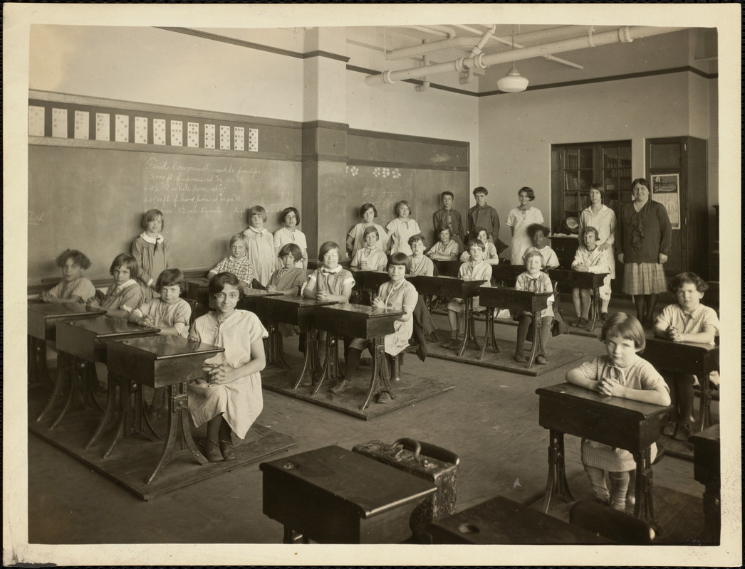 School children sitting at desks in classroom on Long Island in Boston ...