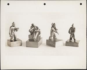 [Left] Man with mallet ; [Center left] Man asleep ; [Center right] Man carrying bucket ; [Right] Man carrying basket