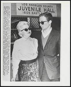 Beverly's Mother Visits Her--Mrs. Florence Aadland, mother of Beverly Aadland, and Ronnie Shedlo, 20, former secretary for Errol Flynn, arrive at Juvenile Hall today to visit Beverly. Miss Aadland, former protege of Errol Flynn, was taken to juvenile hall yesterday after one of her admirers, William Stanciu, shot himself in her apartment. Stanciu died of his wounds early today.