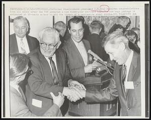 United Steelworkers President I.W. Abel receives congratulations from all sides after the USW accepted a new three-year contract 7/29. The new wage package is estimated at 90-cents an hour to end the threat of a nationwide steel strike.