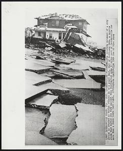 Hurricane Footprint--The concrete pavement of a city street is crushed as though stepped on by a giant foot, that of Hurricane Dora, a massive storm that hurled its fury against this residential area 17 miles east of Jacksonville for more than a dozen hours last night.