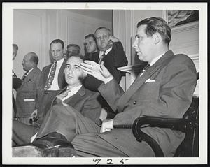 Tobin Makes A Point – Maurice J. Tobin, secretary of labor, gestures as he makes a point during news conference at the Hotel Roosevelt, New York. Seated at left is Robert C. Goodwin, director of the bureau of employment security of the Department of Labor.