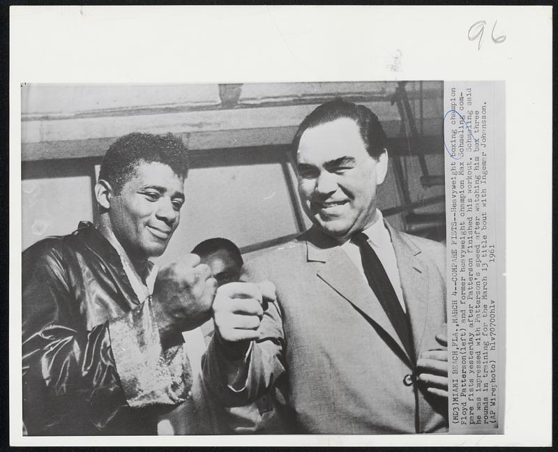 Miami Beach, Fla., March 4--Compare Fists-- Heavyweight boxing champion Floyd Patterson (left) and former heavyweight champion Max Schmeling compare fists yesterday after Patterson finished his workout. Schmeling said he was impressed with Patterson's speed after watching him box three rounds in training for the March 13 title bout with Ingemar Johansson.