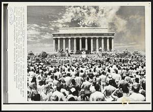 Bombs Bursting in the Air- Bombs burst above the Lincoln Memorial at the conclusion of a religious program there on this fourth of July. There are clouds in the background. This picture was made on infrared film by Harvey Georges, Associated Press Staff photographer.