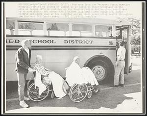 Patients from the Veterans Administration Hospital wait to be loaded on busses to be taken to other hospitals in the area as rescue efforts continue at the Hospital which had sections demolished by an earthquake that struck the Southern California area early 2/9. Early reports had eight dead at the hospital and at least seven other deaths throughout the Southern California area.