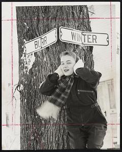 Right Time, Right Place for Joan Martin to hold her ears is at corner of Burr and Winter streets, Brewer, me., when it's 13 below zero.