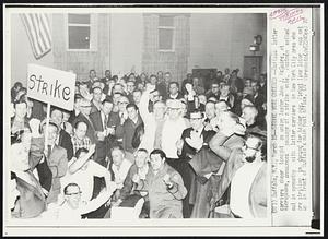 Strike Vote Cheered -- Buffalo letter carriers cheer tonight as union leader John J. McGuire, at microphone, announces passage of a strike vote. Postmen walked out in sympathy with letter carriers in New York City area who are striking in demand for higher pay. Picket line later was set up in front of Buffalo's main post office.