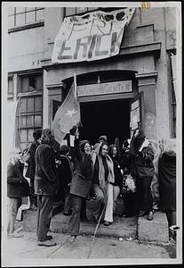 Lib Women leave Harvard building after Middlesex Superior Court Judge Frank W. Tomasello told police to remove them