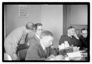 Group of men at table