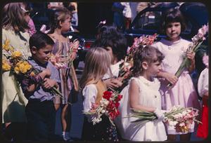 Children holding flowers