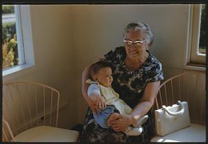 Seated woman holding baby, Swampscott, Massachusetts