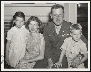 Col. Creig32hton Abrams is Home- Quite willing to pose with the father they have not seen for a year and a half are Noel Abrams, left, and Creighton Abrams III, 4, right, pictured with their parents, Col. and Mrs. Creighton Abrams in West Newton, where the colonel arrived yesterday after a spectacular career in Europe with the Fourth Armored Division.