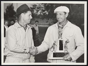 Shea Wins Links Tourney. St. Petersburg, Fla. Mervin Shea (right), coach of the Detroit Tigers, who won the 1941 Baseball Players Golf Tournament here yesterday, receives congratulations from Lloyd Brown, former Big League Southpaw, who was runner up. It was the 6th annual baseball players’ tourney on the Jungle Club Course.