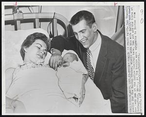 Bruins Goalie Is Proud Pappy-Don Simmons, goalie for the Boston Bruins, visits with his wife Betty, and their new born son at the Ludlow Hospital here. Don got off the train at Springfield, Mass., as the Bruins were returning to Boston from Detroit.