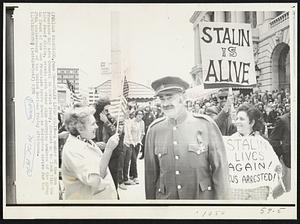 San Francisco -- Stalin Lives Again -- A member of the San Francisco Bay Area Council on Soviet Jewry, dressed up to look like late Josef Stalin, stands with other sign carrying members of the group in front of the San Francisco Opera House as delegates arrive for the 25th anniversary of the United Nations Friday afternoon. Demos Misc 1970.