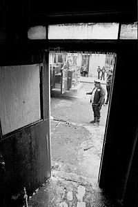 A Red Cross worker and Chelsea Record journalist Josh Resnek standing outside 178 Pearl St.