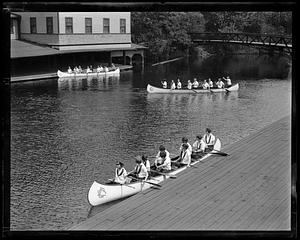 LaSalle college girls in their war canoes, Charles River, Auburndale