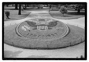 "1787-1937" floral design of the Great Seal of the United States in front of Ether Monument, Public Garden