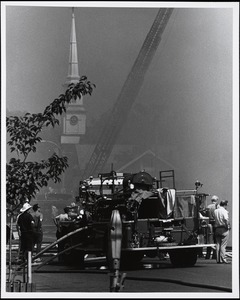 Looking towards the Unitarian Church and Dedham Avenue from the Town Common, during the Needham Square fire of May 22, 1977