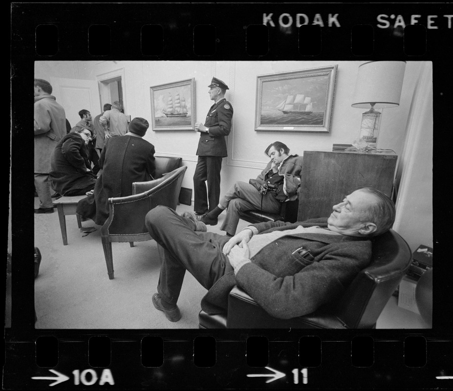 Men sitting in chairs in MIT President Johnson's during student demonstrations