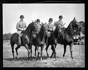 Four people on horseback