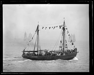 People watching a race on a ship