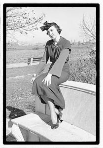A model posing by the Oliver Wendall Holmes Memorial Sundial