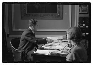 A man seated at a desk