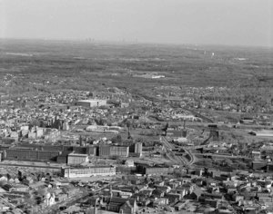 Looking south over Lord Overpass to big view of Lowell and Boston skyline