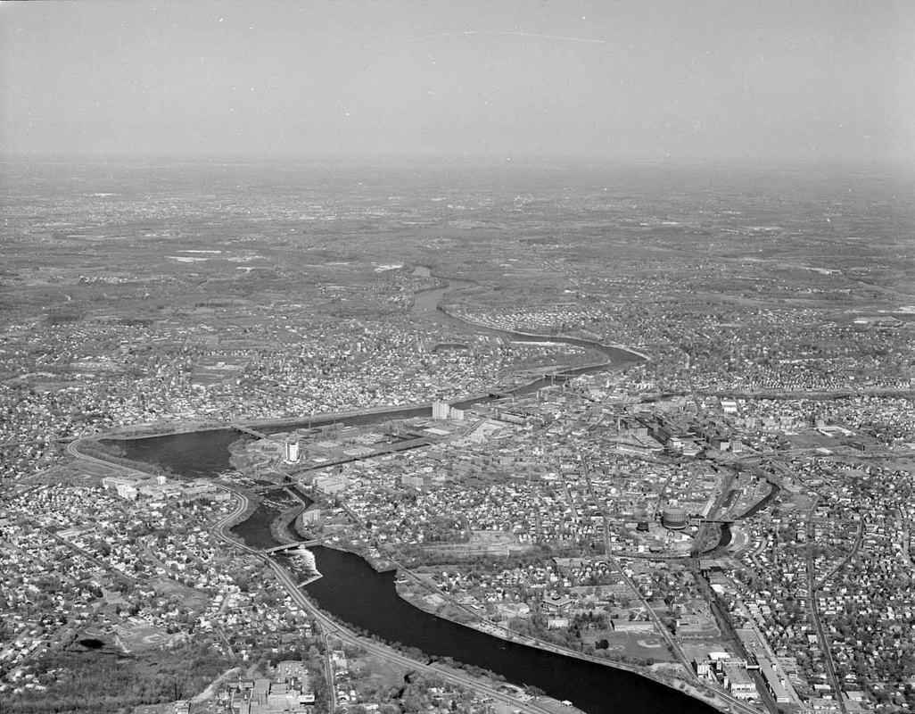 Looking SE along Merrimack River toward bunt showing big view of Pawtucketville, Centralville, Downtown, and Acre