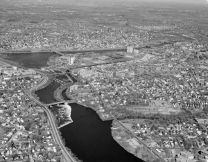 Looking up Merrimack River over Falls to bunt and across big view Lowell