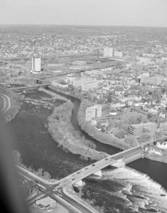 Looking down Merrimack River at School St. Bridge) at big view of Lowell