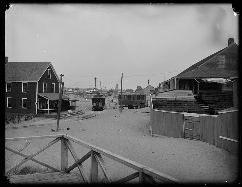 Trolley car moving through a neighborhood - Digital Commonwealth