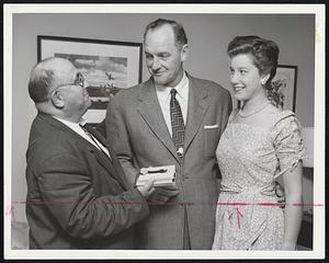 From The Fans -- Lou Kleppel, who made the trip from New York where he had collected fan contributions for the gift, presents Giants Coach Frank Shellenback a watch while daughter Margaret Shellenback looks on.