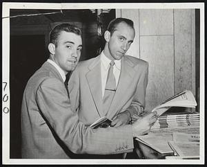 White Sox Pitching Stars Bill Pierce (left) and Howie Judson catch up on the new as they check in at the Hotel Kenmore for the opening game of the series with the Red Sox tonight at Fenway Park. Judson is slated to hurl for the Chisox against young Leo Kiely.