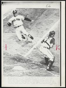 Cleveland, Ohio – Wasted Effort – Dick Schofield of the Boston Red Sox grimaces and starts a slide into home plate and Ken Suarez, Cleveland Indians Catcher, waits for a throw that never materialized. Schofield scored after George Thomas singled in the second and was caught in a run-down after rounding first base here last night.