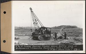 Contract No. 72, Clearing a Portion of the Site of Quabbin Reservoir on the Upper Middle and East Branches of the Swift River, Quabbin Reservoir, New Salem, Petersham and Hardwick, P and H crane moving stump above Baffle Dam in Greenwich, Greenwich, Mass., May 17, 1939