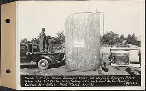 Contract No. 85, Manufacture and Delivery of Precast Concrete Steel Cylinder Pipe, Southborough, Framingham, Wayland, Natick, Weston, cracks in 7 foot pipe section developed under 375 lbs./sq. in. pressure, picture taken after test was finished, looking southeast, Natick, Mass., Aug. 11, 1939