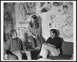 The main counseling room of the Open Door Clinic in Seattle is decorated with graffiti and psychedelic murals. The clinic offers unconventional services to alienated young clients, often illicit drug users: free treatment and advice from volunteer doctors and nurses, without direct criticism and without police informing. Seated, from left to right, are Al Weese, clinic director, Mrs. Robbie Fish, receptionist, and Dr. John Green, board of directors member.