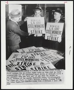 Union All Set for Steel Strike - Steel workers try on picket signs today as they wind up their preparations for the scheduled steel strike at midnight April 8 and announce they are "all set" if and when the strike is called. Workers of the nearby Homestead works, , with the signs are (left to right) Rudolph Kronket, Stephen Vadas and James Hagas.