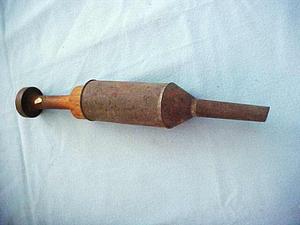 Metal implement with a wooden handle