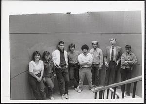 Group of people, possibly students, posing in a stairwell