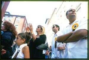 Boston 2002: a woman on the sidelines (c) applauses during the Feast of St. Anthony In Boston's N. End
