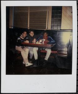 Trio of boys in a booth