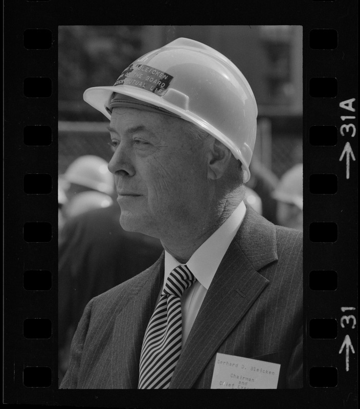 Gerhard D. Bleicken, Chairman and CEO, seen with hard hat at the "topping off" of the new John Hancock Tower