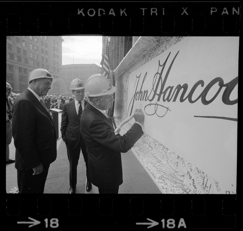 Gerhard Bleicken, Chairman, Frank Maher, President, both of John Hancock Mutual Insurance Company, and Mayor Kevin White signing the beam during the "topping off" ceremony for the new tower