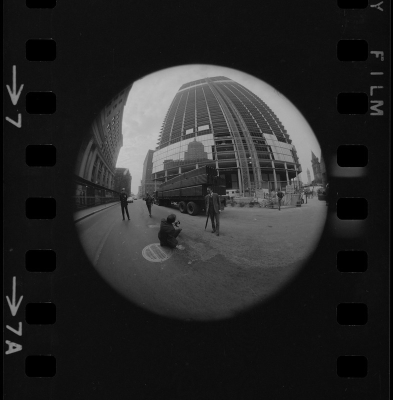 I.M. Pei seen being photographed in front of the John Hancock Tower while under construction