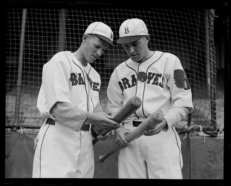 Boston Braves players Al Wright and Dick Gyselman compare their bats at Braves Field