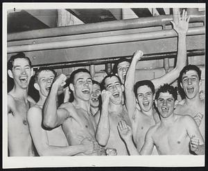 NCAA Basketball Champions--Members of the Kentucky team flash victory smiles in their dressing room after defeating Kansas State, 68-58, in last night's NCAA title game at Minneapolis. Left to right, Roger Layne, Frank Ramsey, Cliff Hagan, Dwight Pierce, C. M. Newton, Bill Spivey, Lucian Whitaker, Bobby Watson and Louis Tsioropoules.